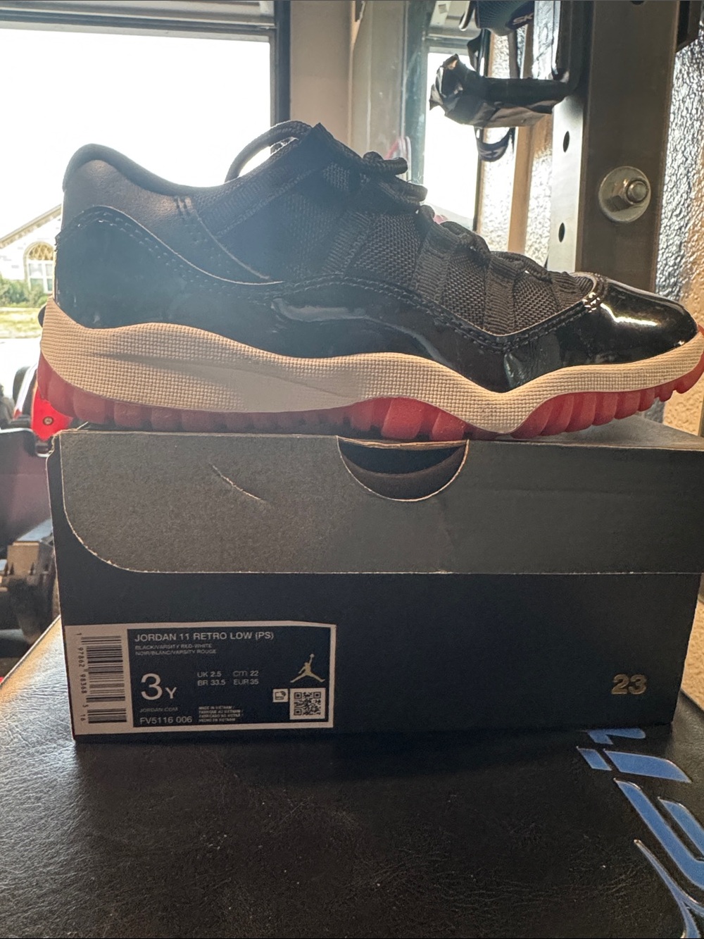 Jordan 11 Retro Low Boys Black with Red Outsole